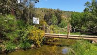 El arroyo de El Chorrillo delimita el Parque Nacional. Su puente marca la entrada al mismo por la ruta del Boquerón del Estena. El arroyo de El Chorrillo delimita el Parque Nacional. Su puente marca la entrada al mismo por la ruta del Boquerón del Estena.
